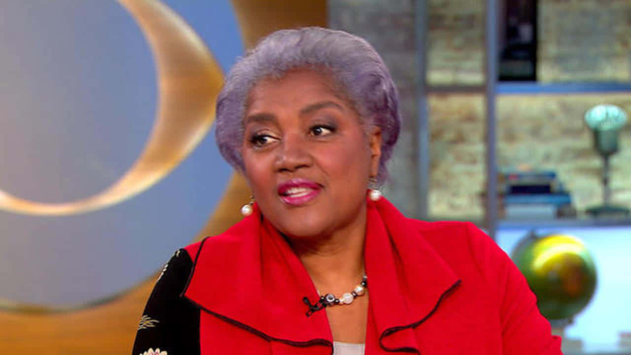 Donna Brazile Delivering Her Engaging Public Speech Background