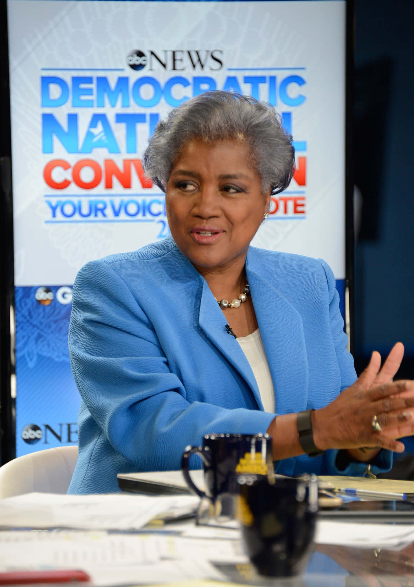 Donna Brazile Engaging In A Thoughtful Discussion Background