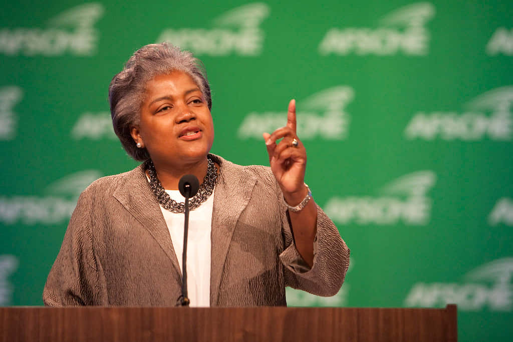 Donna Brazile Posing Confidently In A Studio Background
