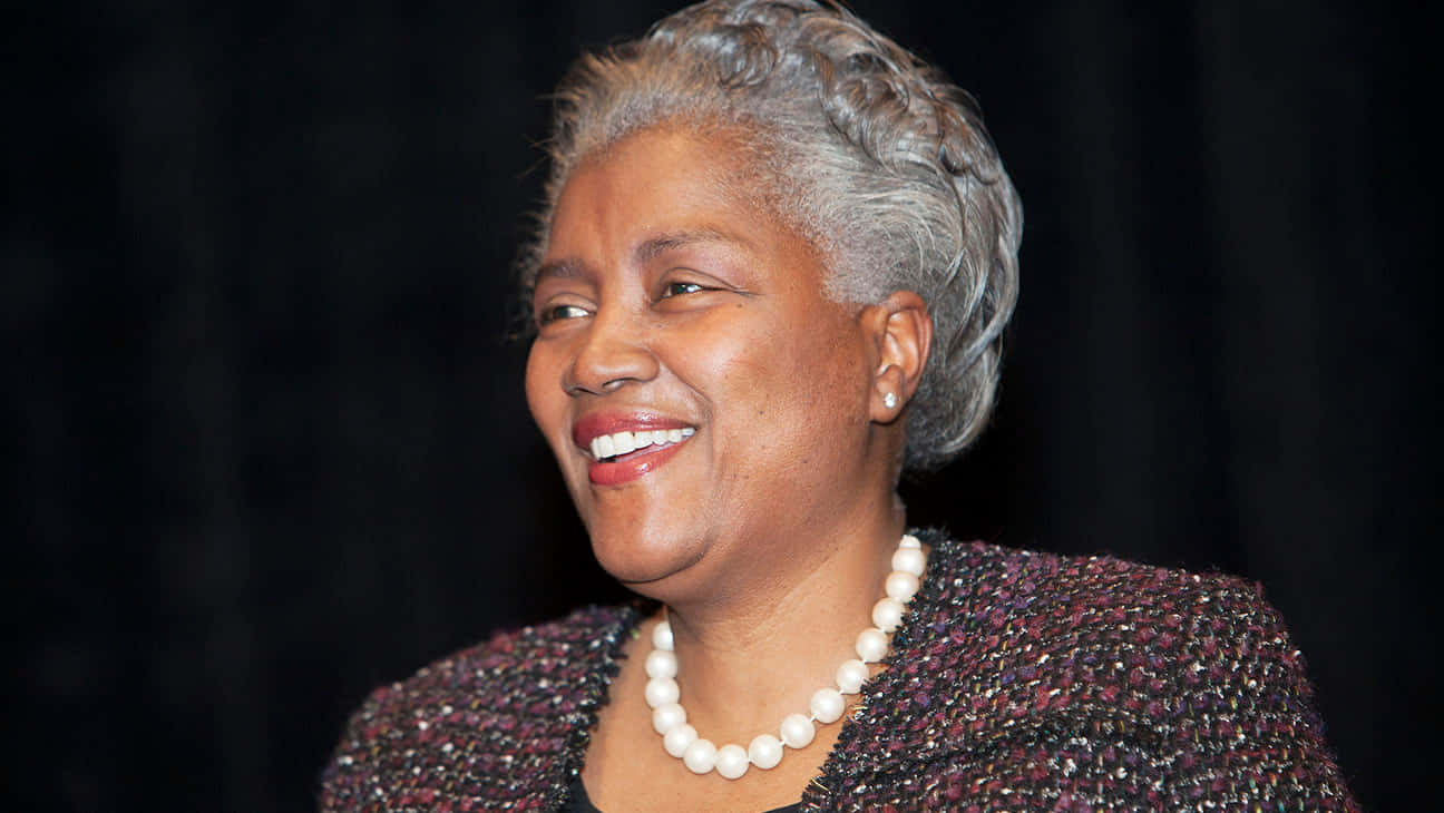 Donna Brazile Smiling At An Event Background