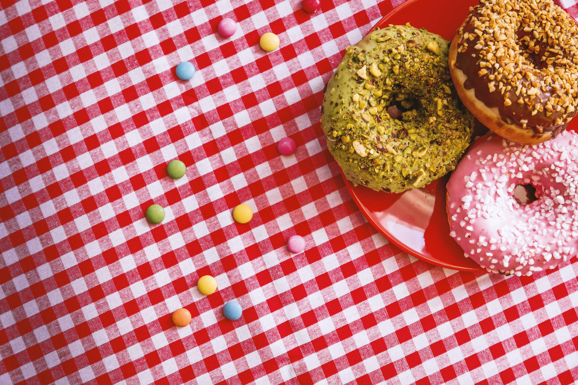 Donuts On Gingham Cloth Background