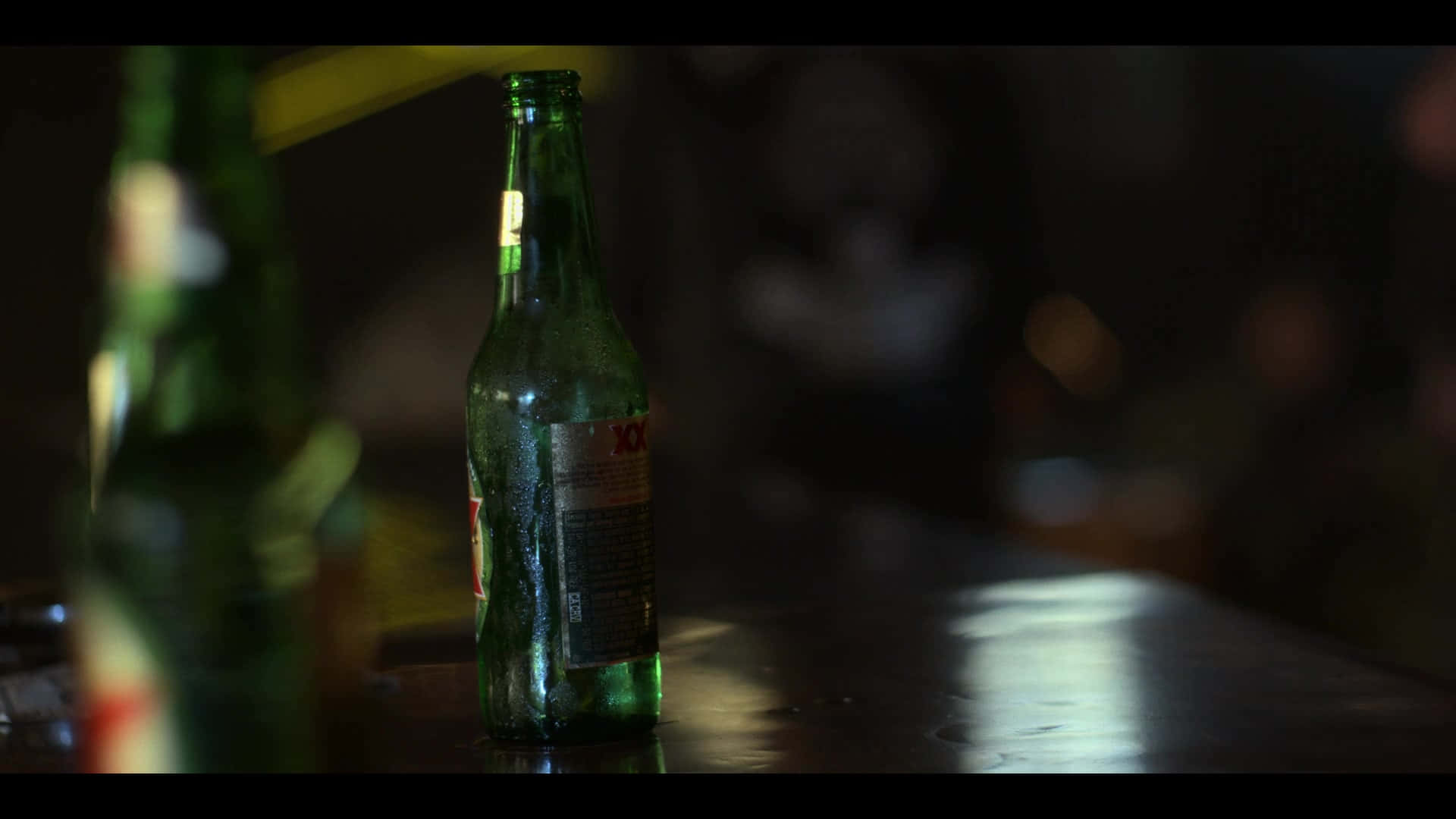 Dos Equis Beer Bottleon Bar Counter Background