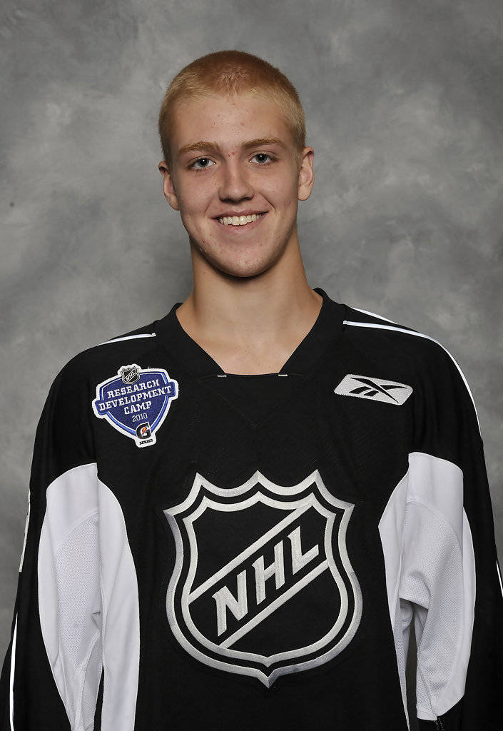 Doug Hamilton Posing At The 2010 Nhl Training Camp Background