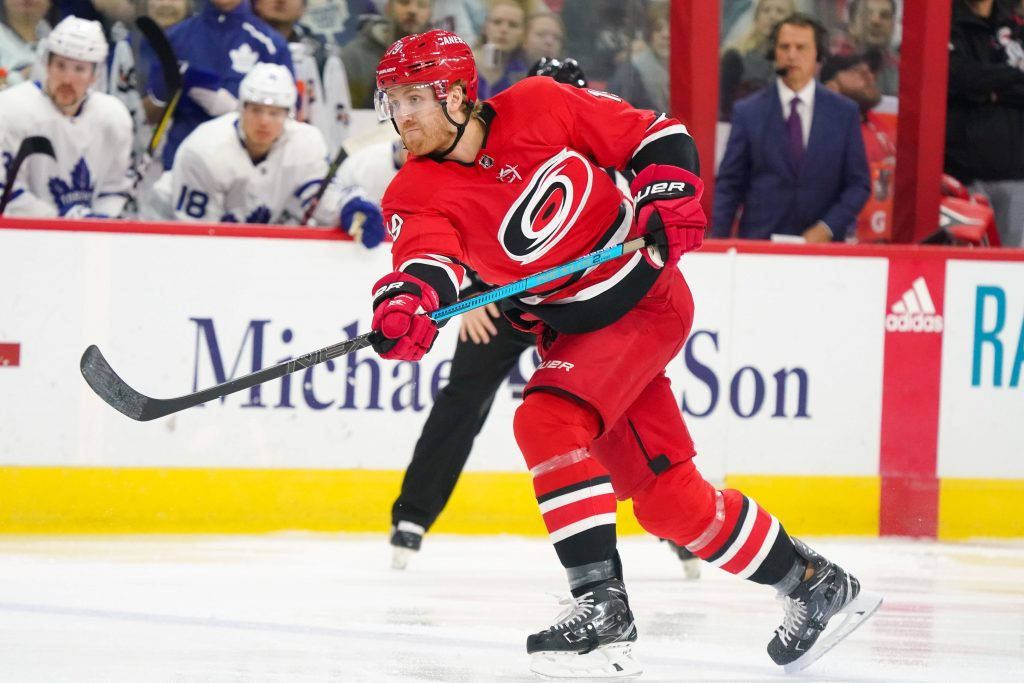 Dougie Hamilton Carolina Hurricanes Pass Puck Background