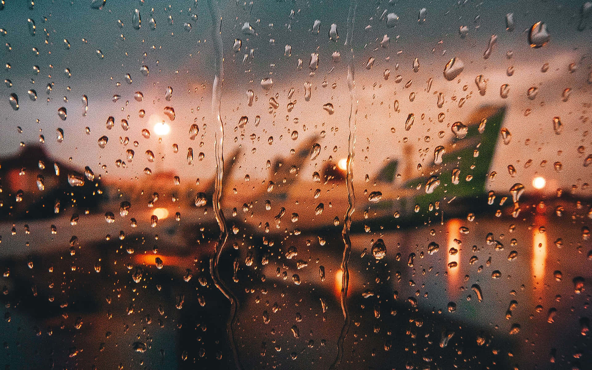 Downtown View Of A City Street In The Rain Background