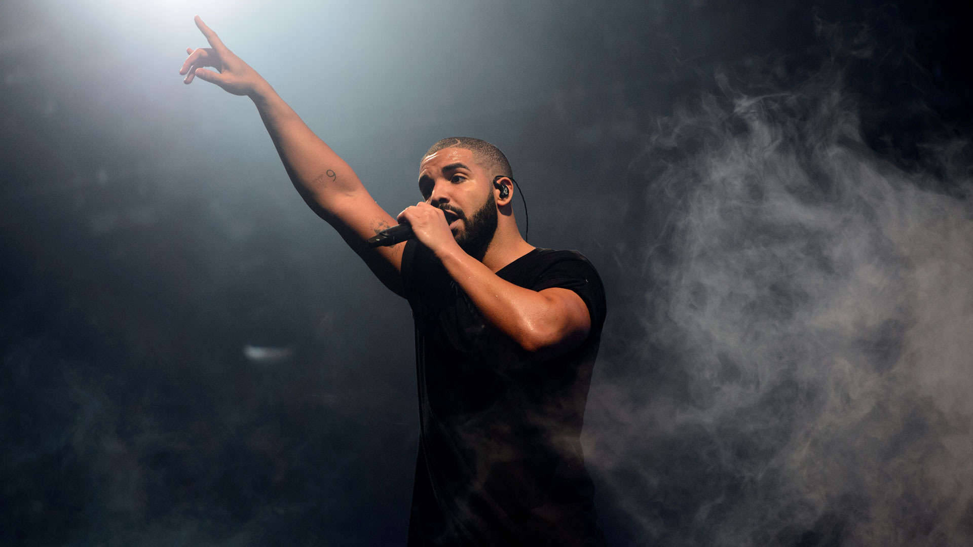 Drake Ovo Takes The Stage In An Energetic Performance Background