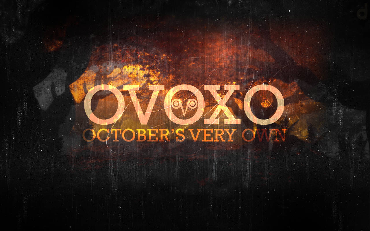 Drake's Gleaming Ovo Logo In The Spotlight Background