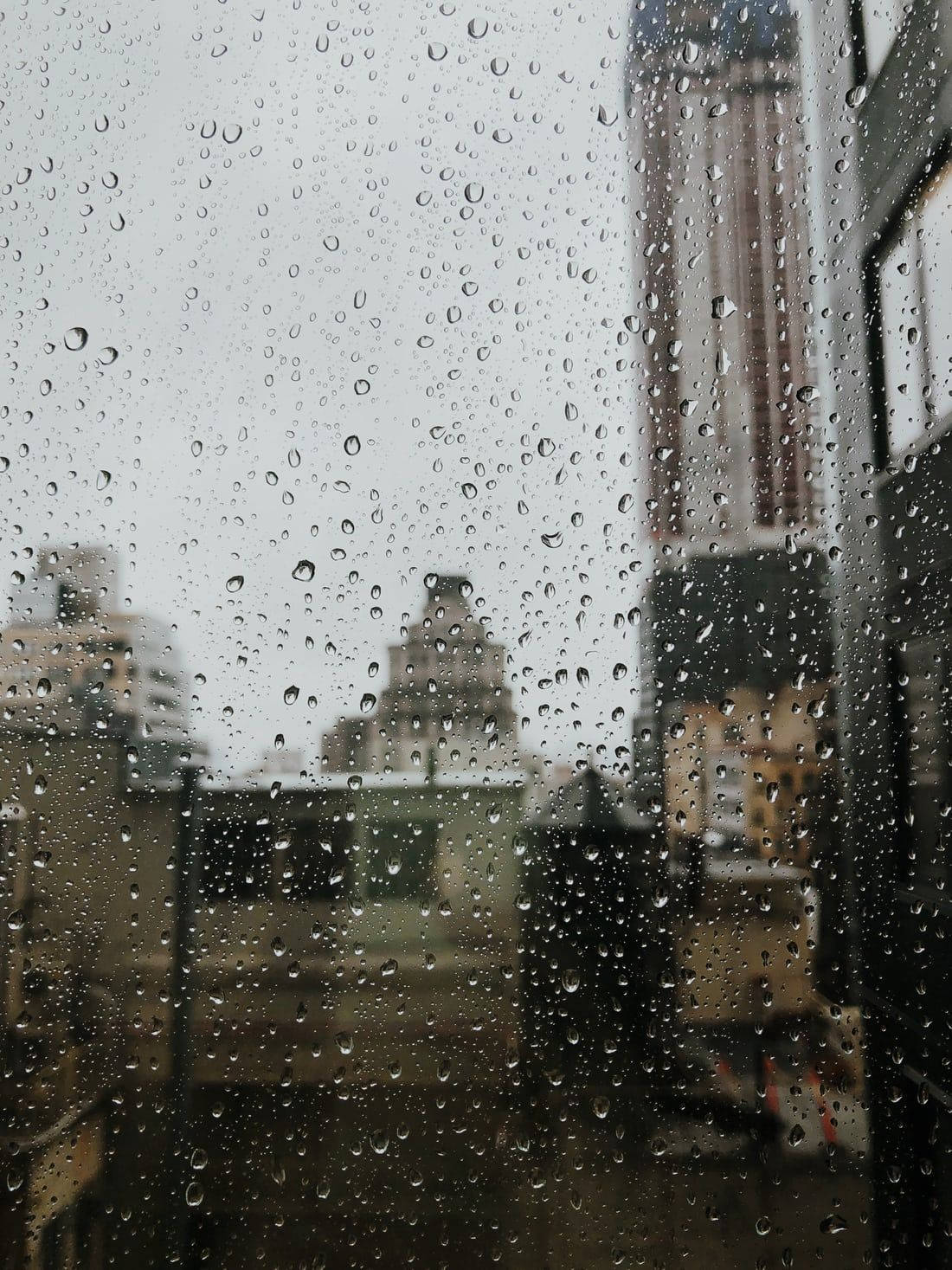 Dramatic Raindrops On Window Glass Pane