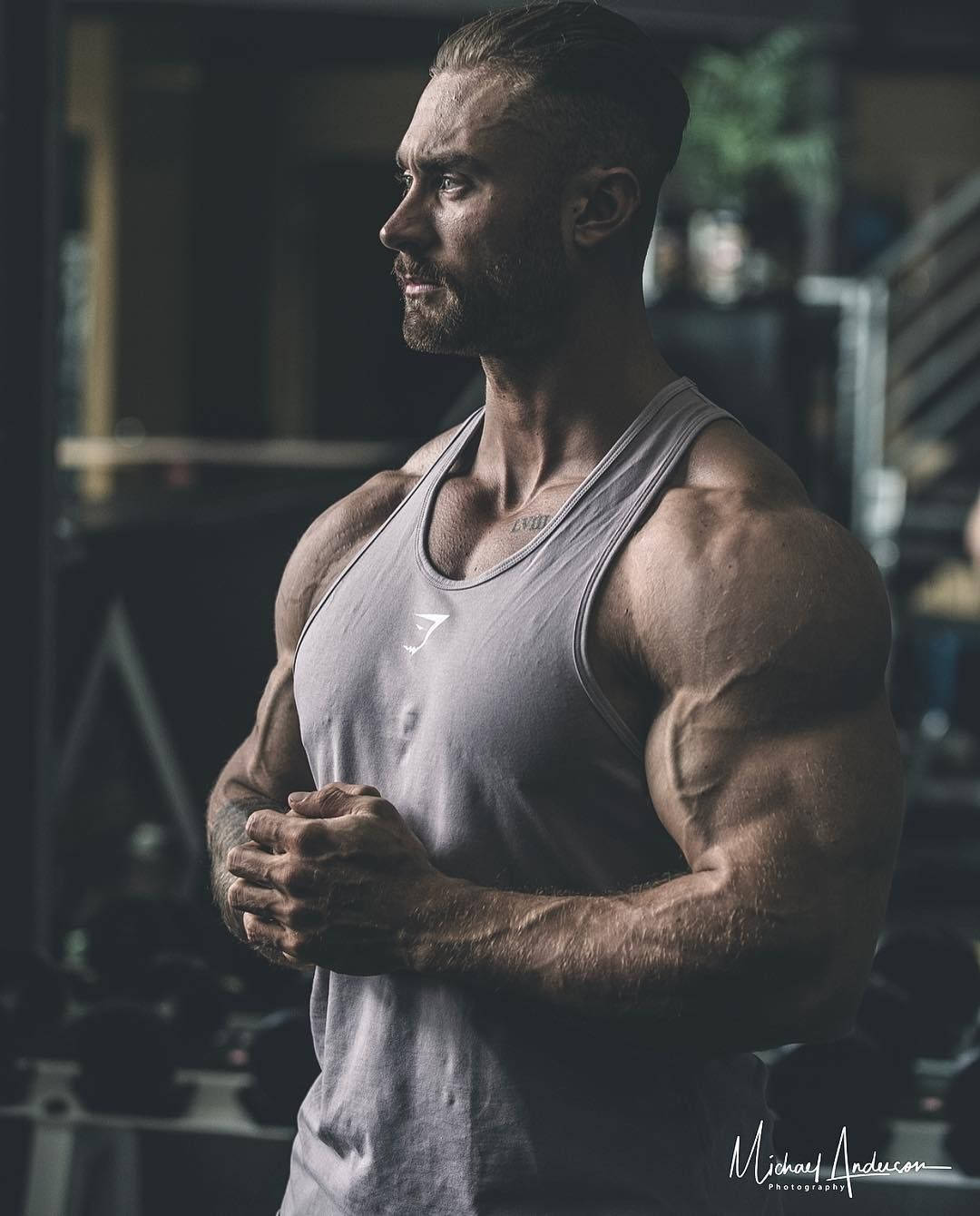 Dramatic Side Profile Of Chris Bumstead Background