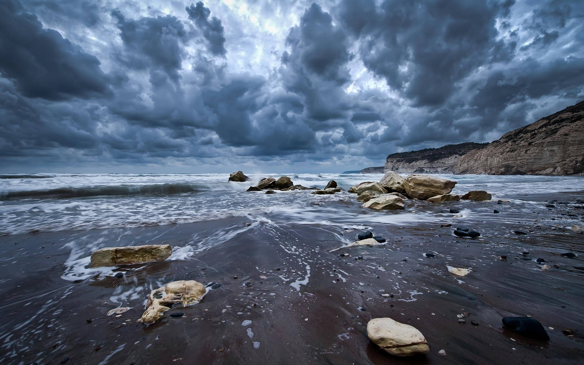Dramatic Storm Rolling In Over Rocky Beach Retina Image Background