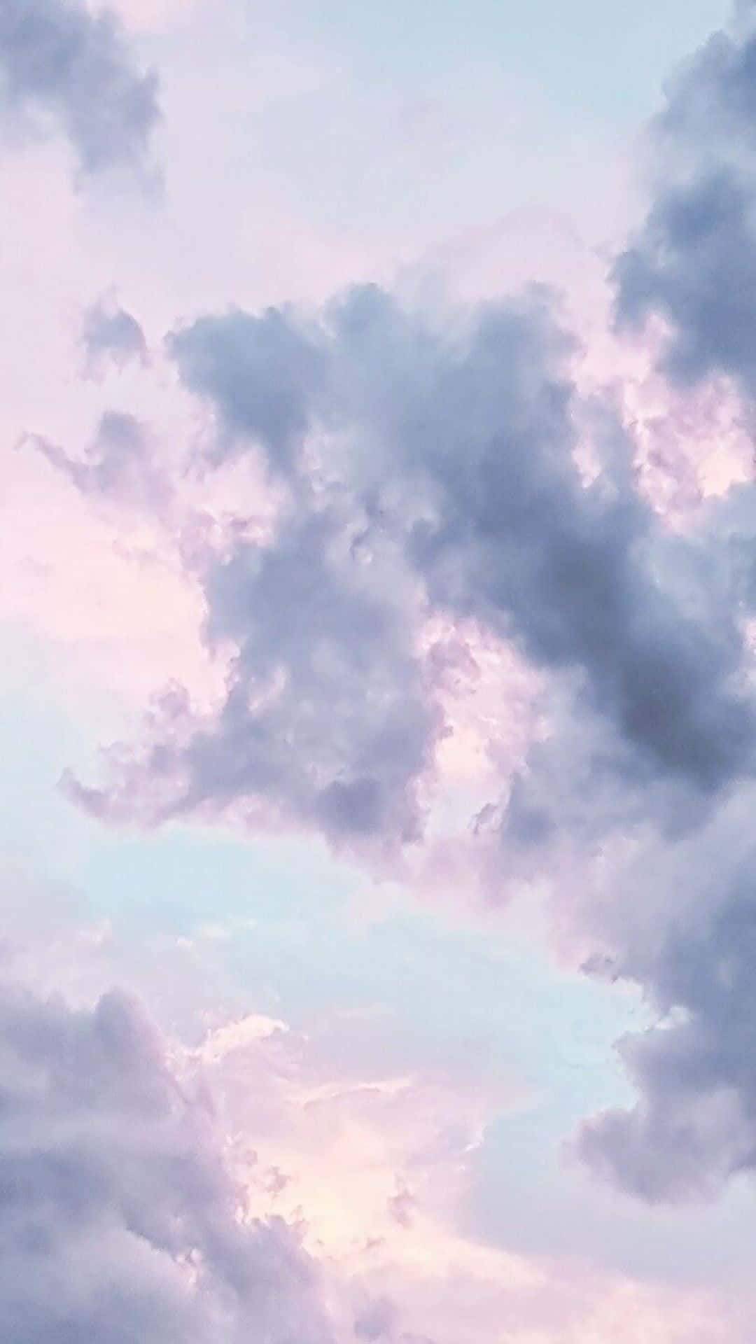Dreamy Clouds Float Above A Brilliant Sunset Background