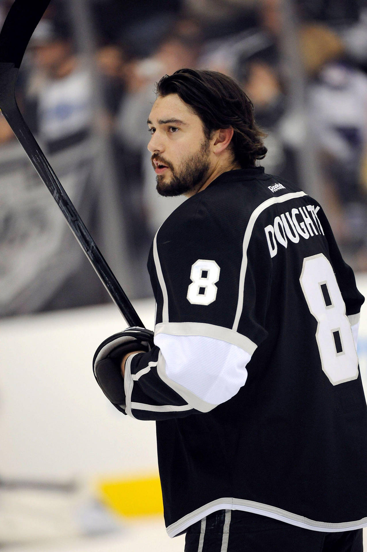 Drew Doughty - Focused On The Game With Hockey Stick In Hand. Background