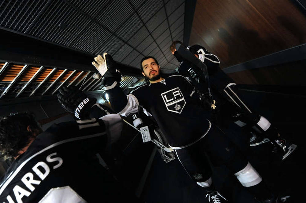 Drew Doughty Hands Up To High Five Teammate Mike Richards Background