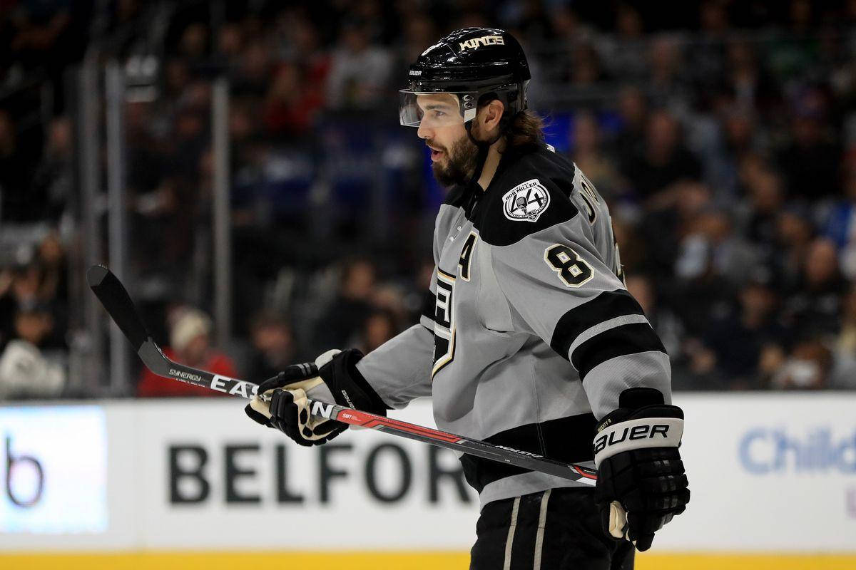 Drew Doughty Holding Hockey Stick During Game Background