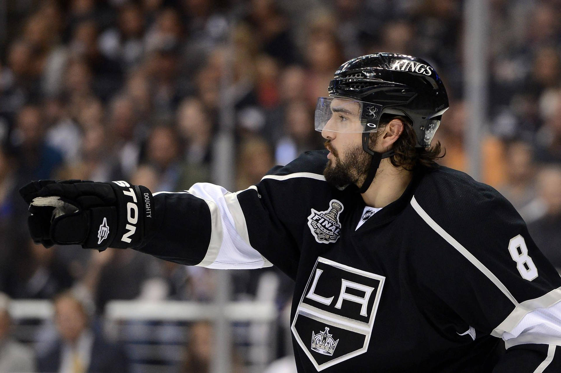 Drew Doughty Pointing With Right Hand During Game Background