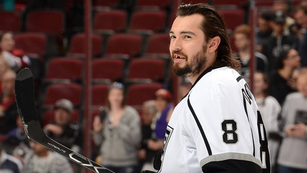 Drew Doughty Smiling While Looking To The Left Background