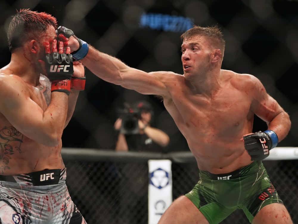 Dricus Du Plessis Delivering Powerful Head Punch In A Fight Background