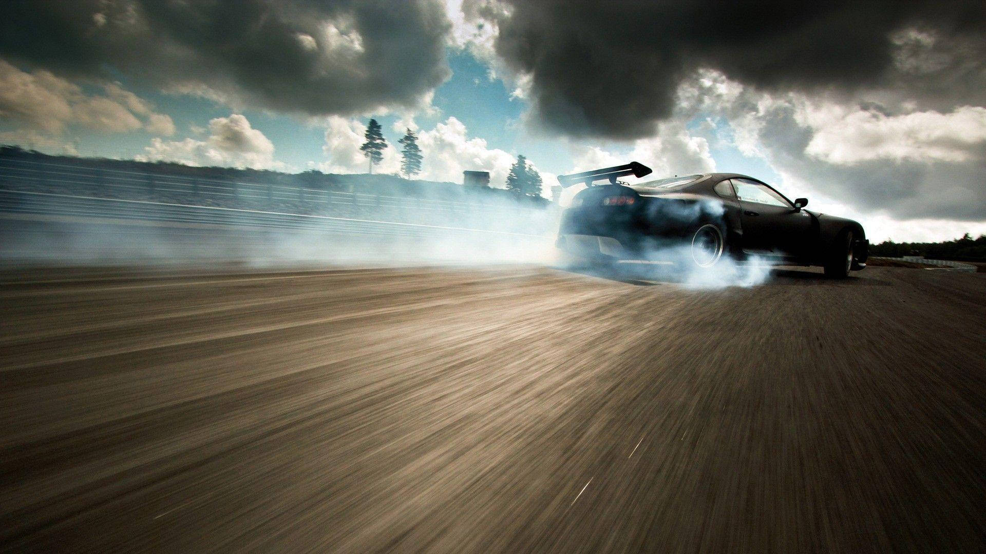 Drift Car Speeding Under Stormy Clouds Background