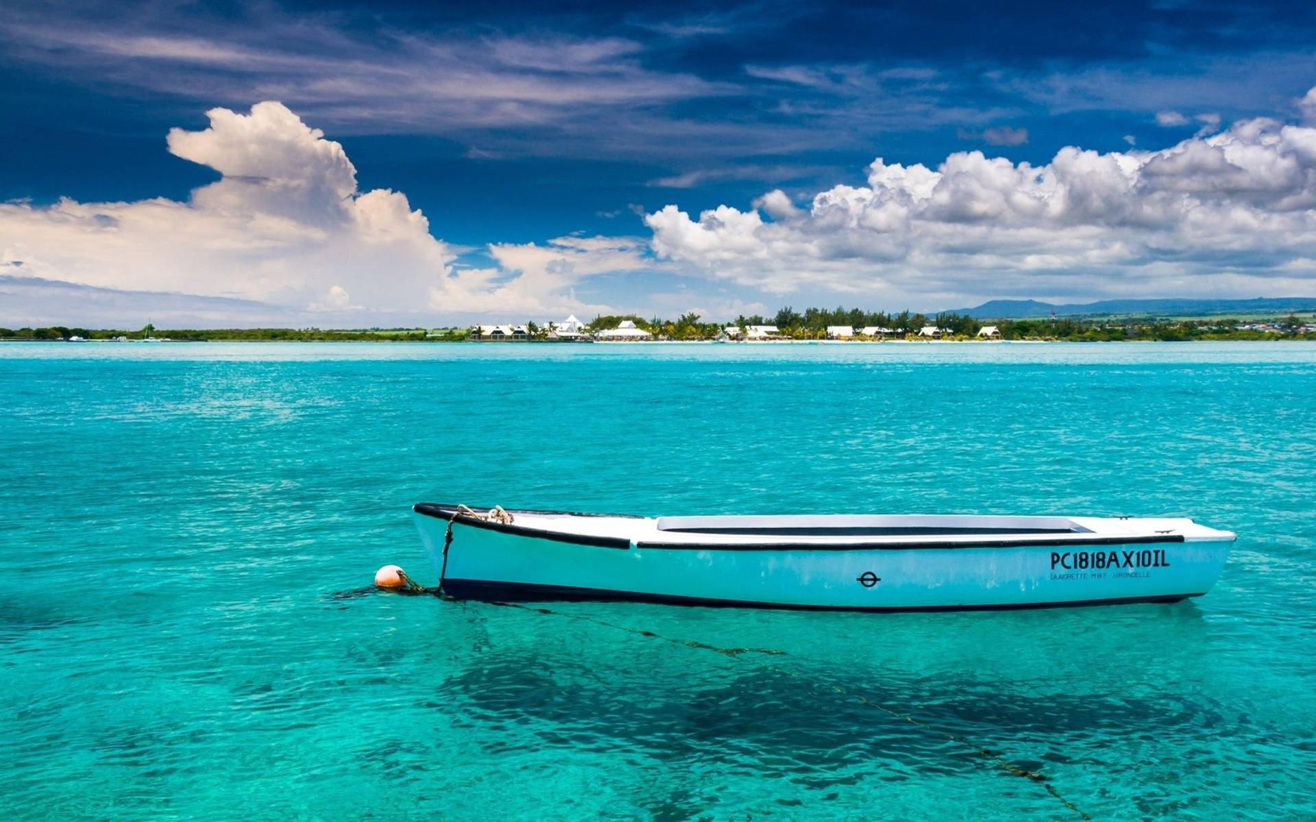 Drifting Boat On Blue Water Background