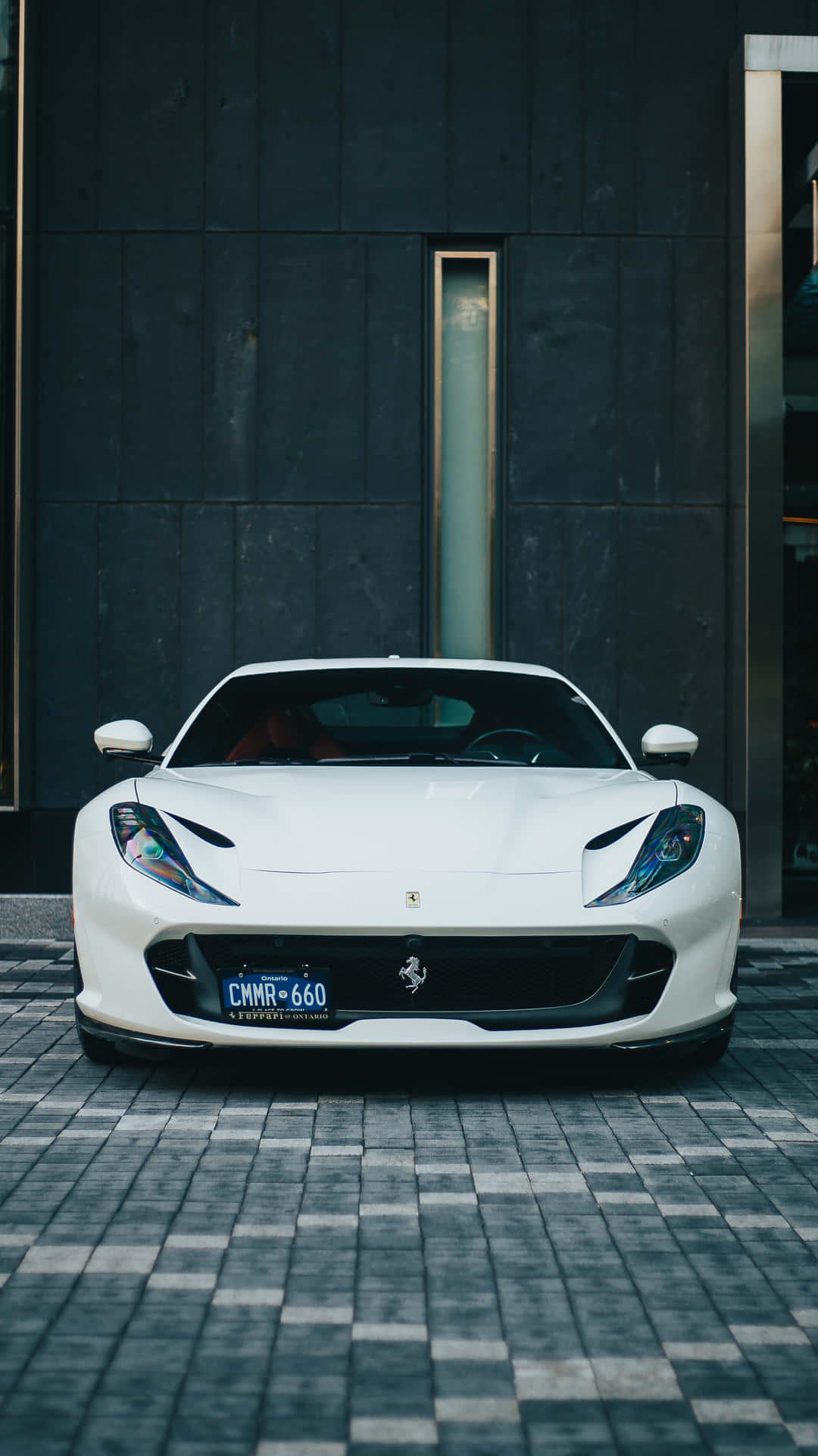 Driving Luxury In Style With A White Ferrari Iphone. Background