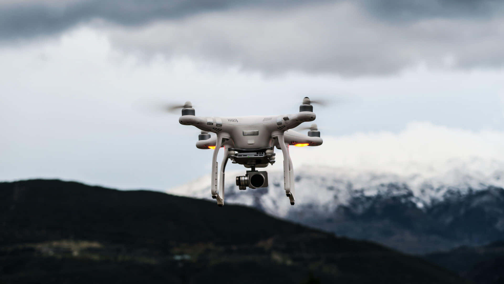 Drone_ Flight_ Over_ Mountainous_ Terrain Background