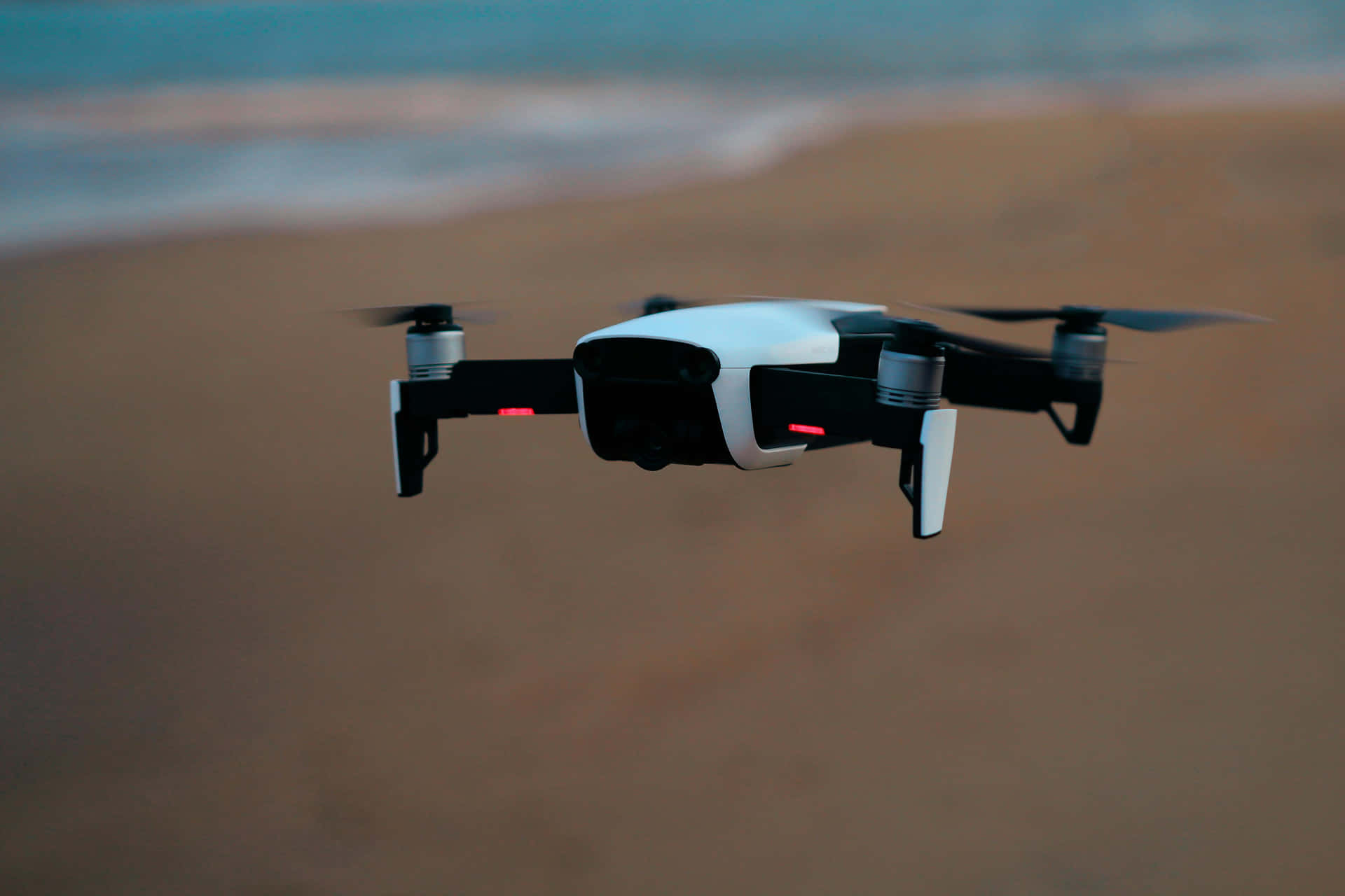 Drone In Flight Over Beach Background