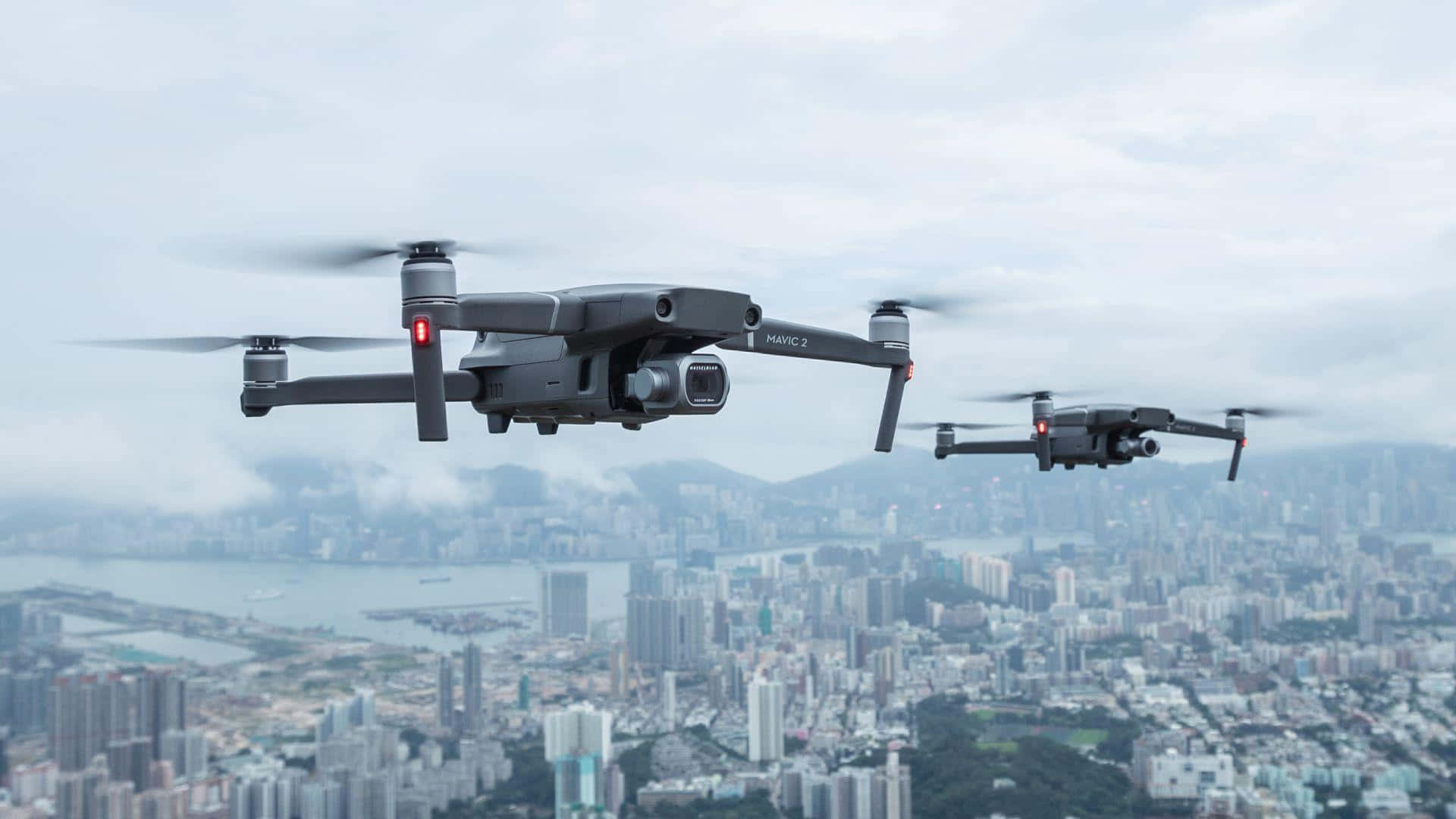 Drones Over Cityscape Background