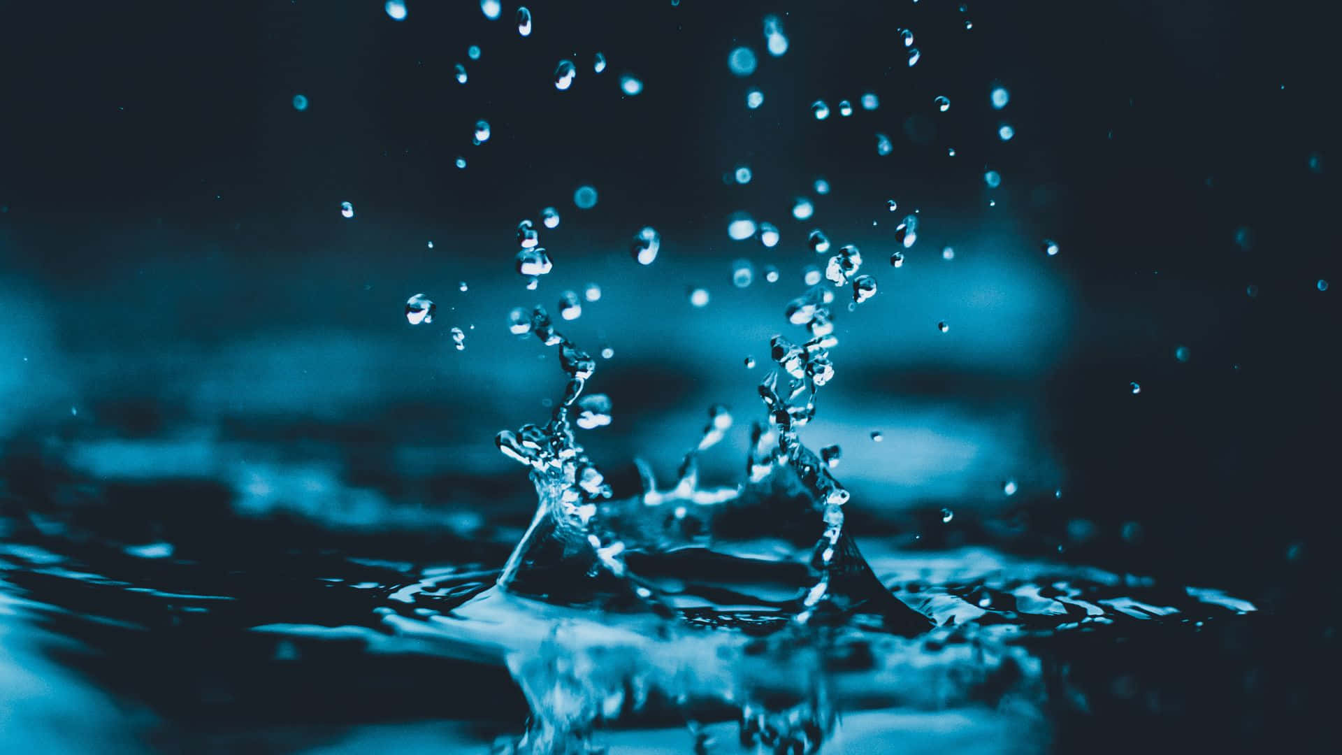 Droplets On Shallow Pool Of Water Background