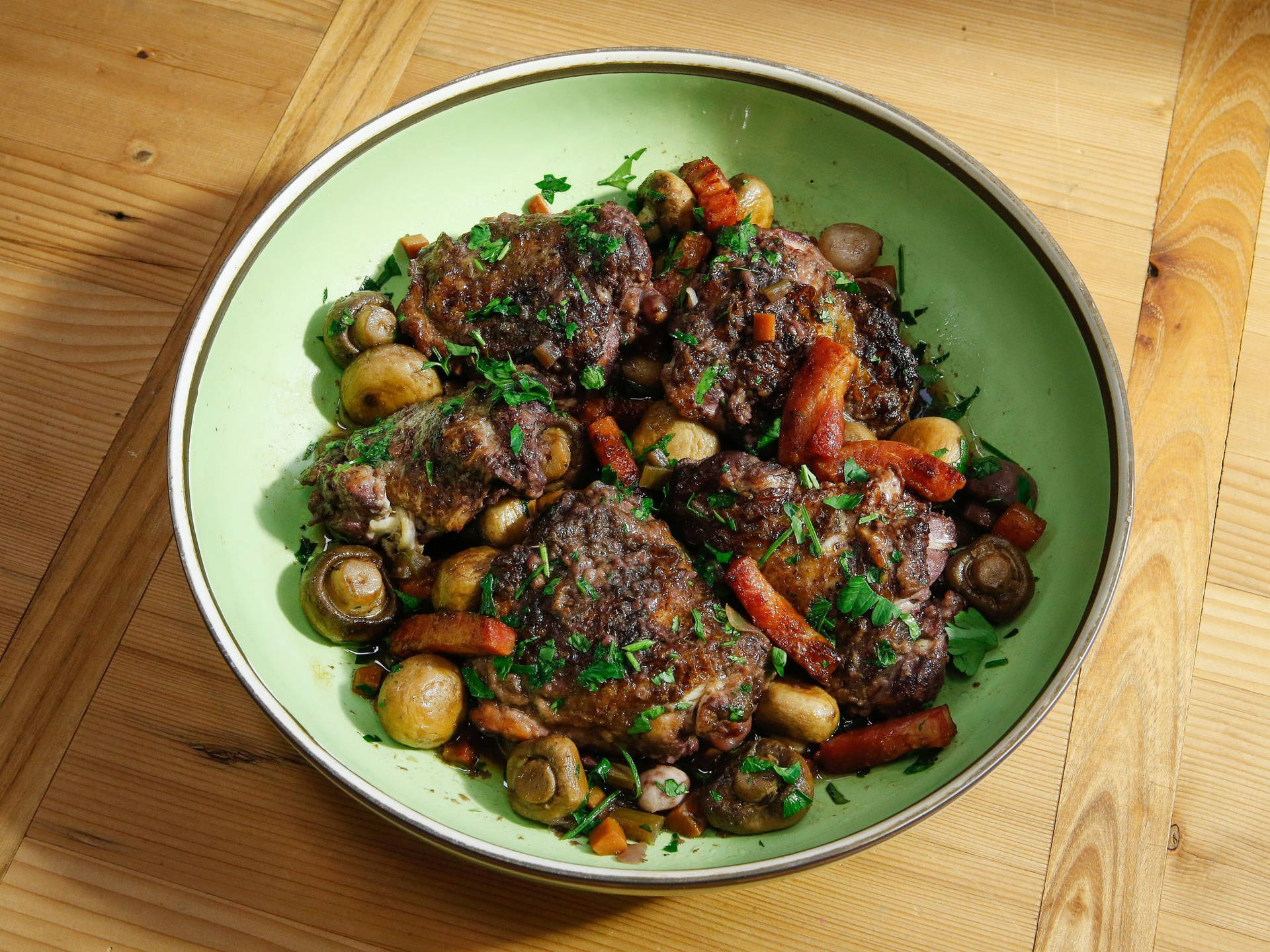 Dry Coq Au Vin Served On A Green Round Plate Background