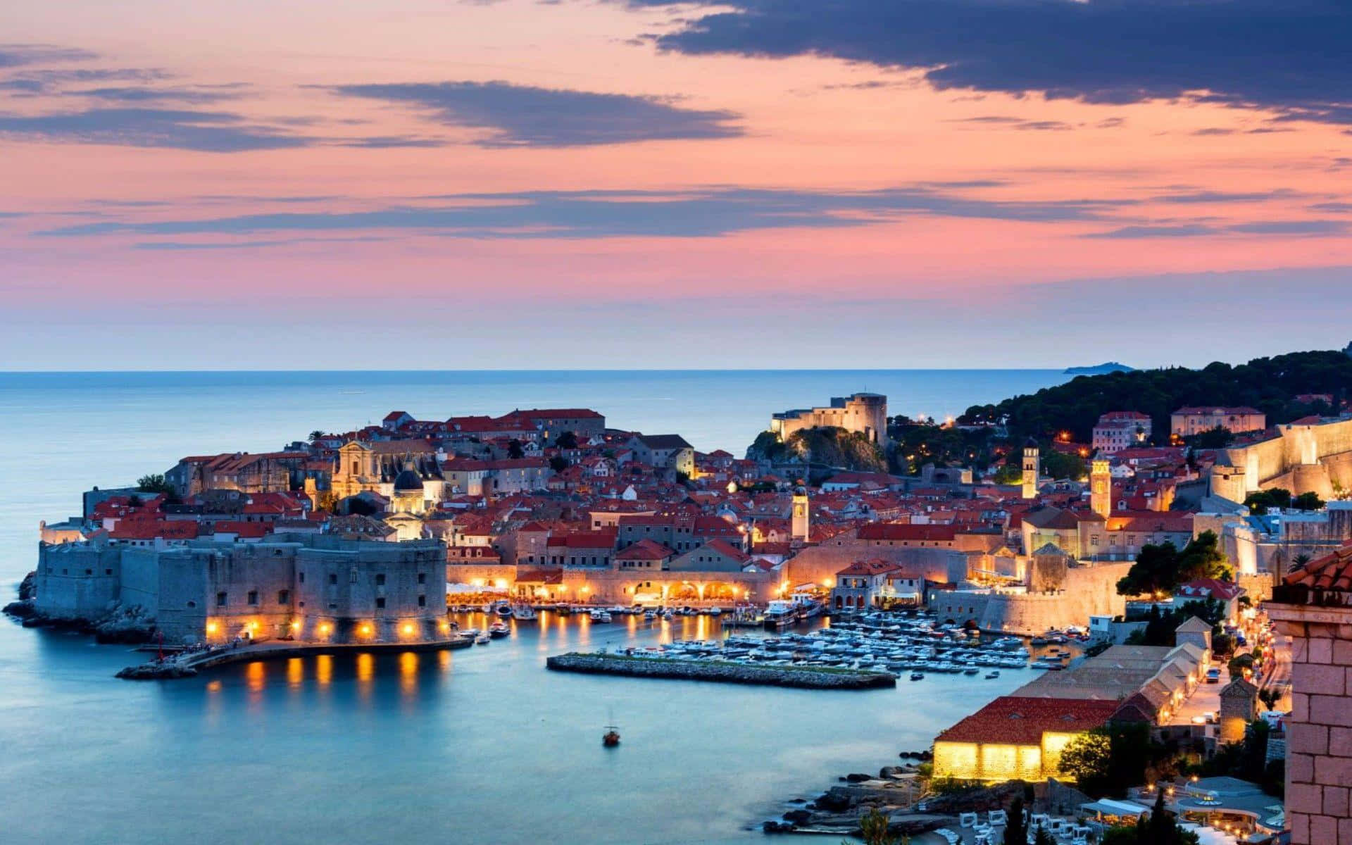 Dubrovnik Filled With Orange City Lights Background