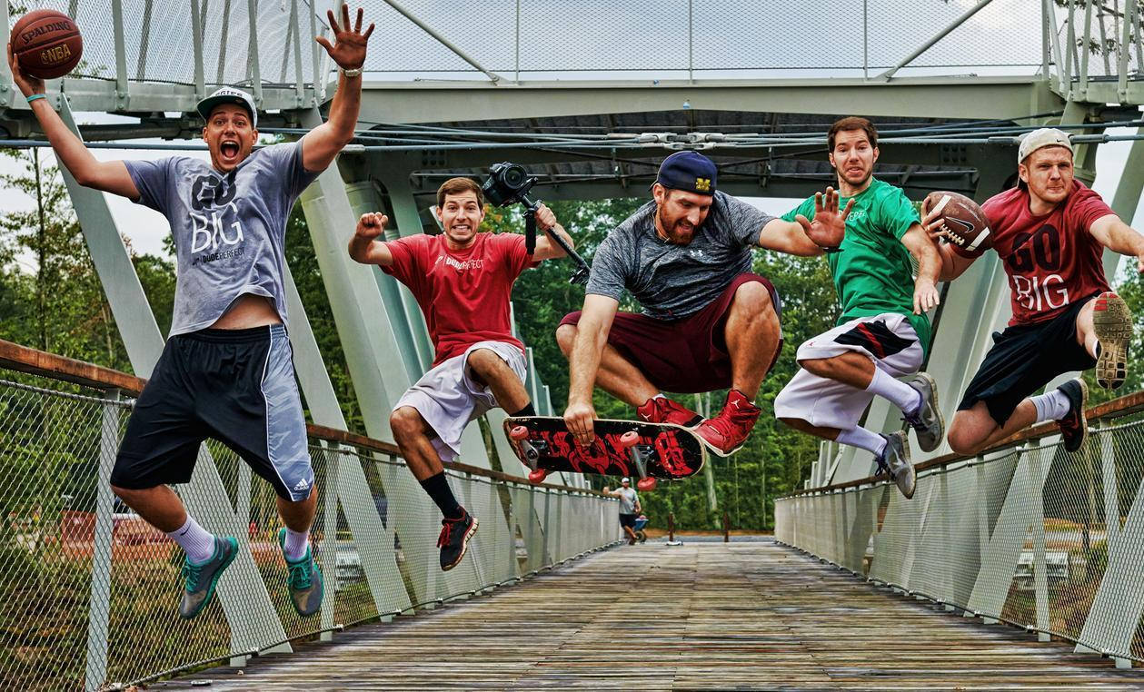 Dude Perfect Team Leaping Off A Bridge Background