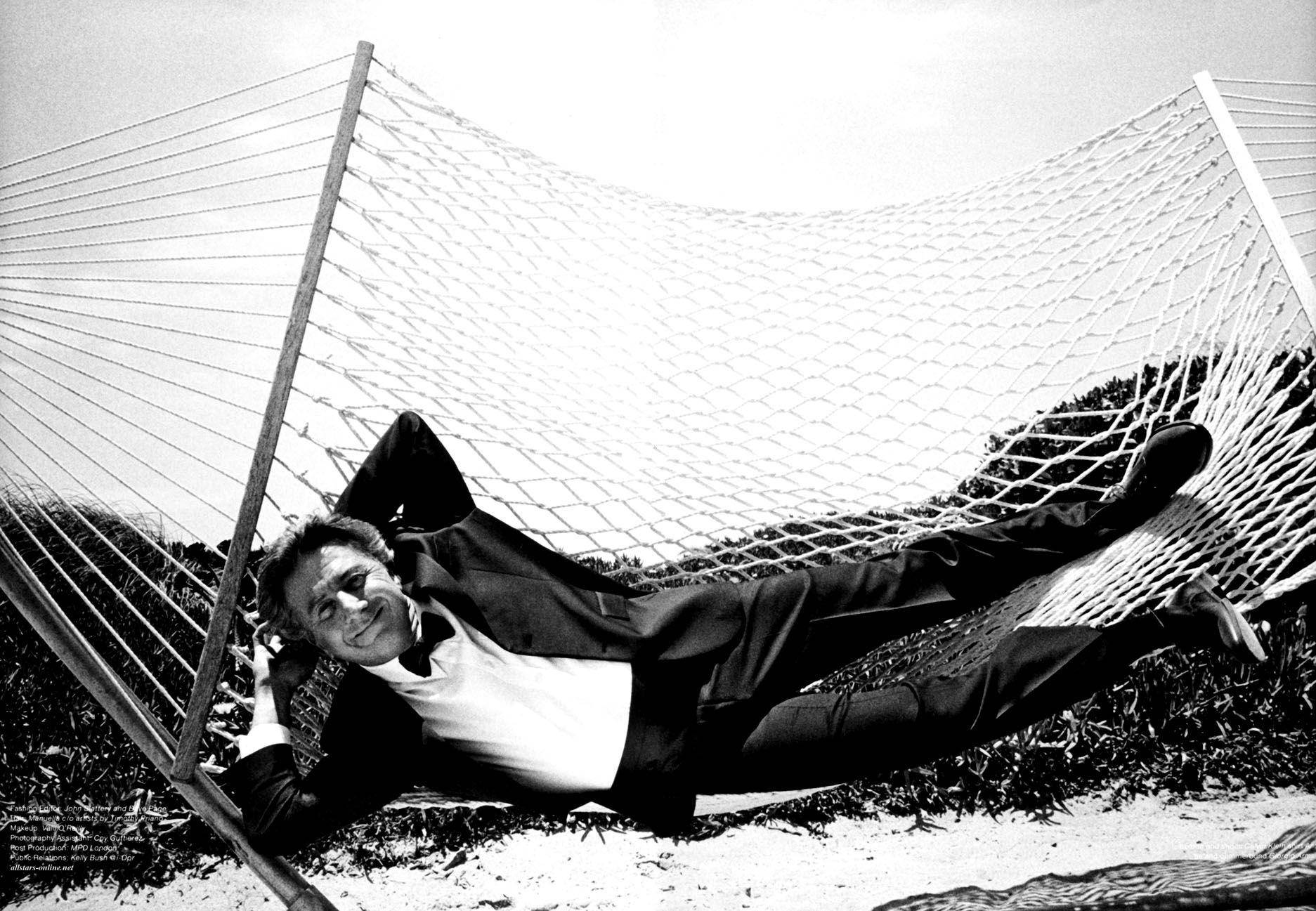 Dustin Hoffman Swinging On A Hammock Background