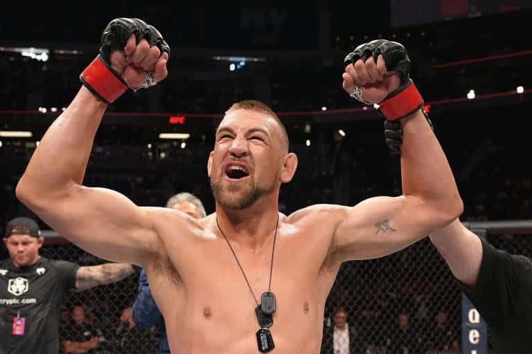 Dustin Jacoby Cheering Flexing Arms Background