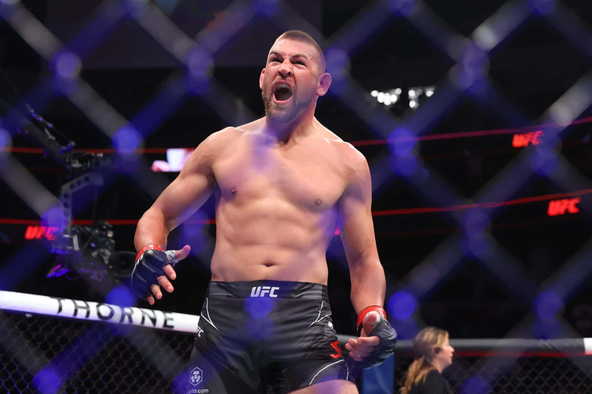 Dustin Jacoby Shouting Inside Ring Background