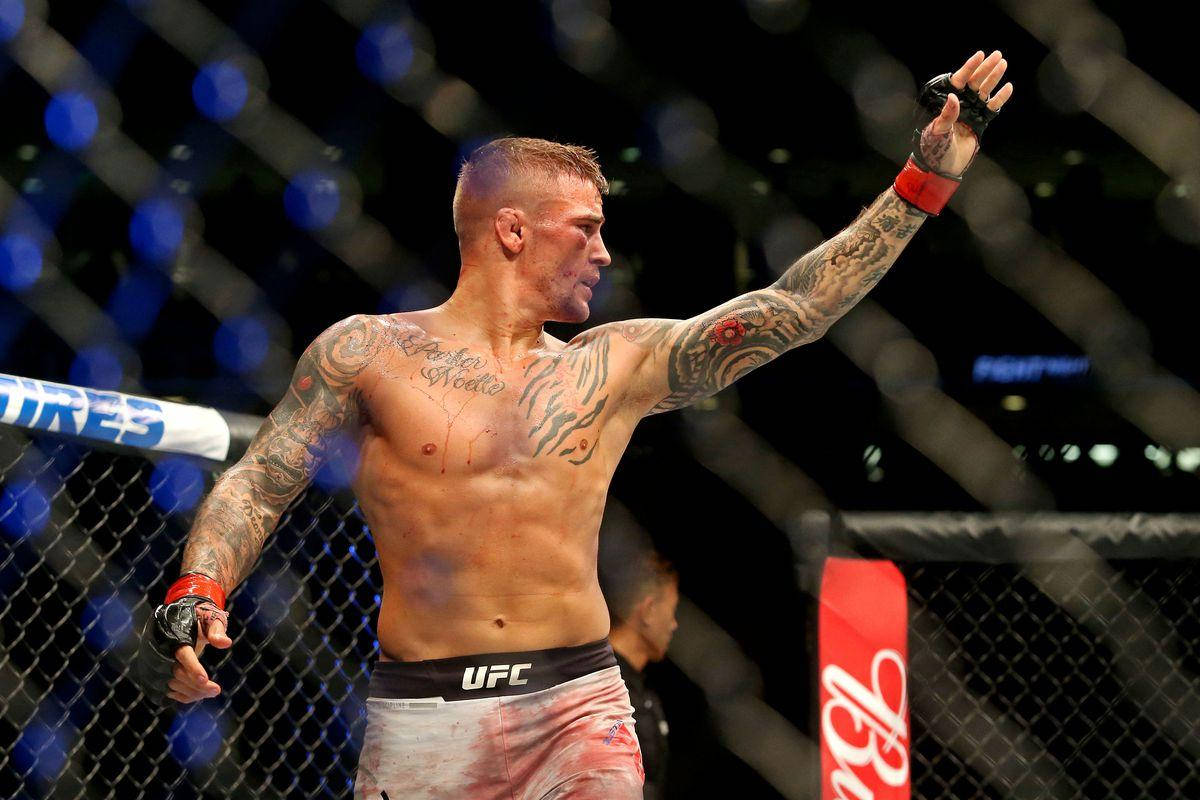 Dustin Poirier Bloody Face Raised Hand Background