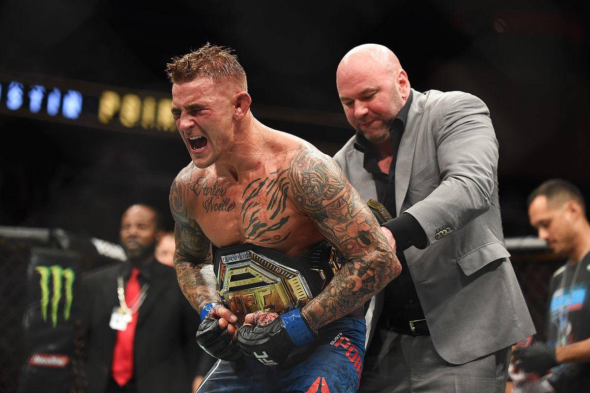 Dustin Poirier Putting On Belt