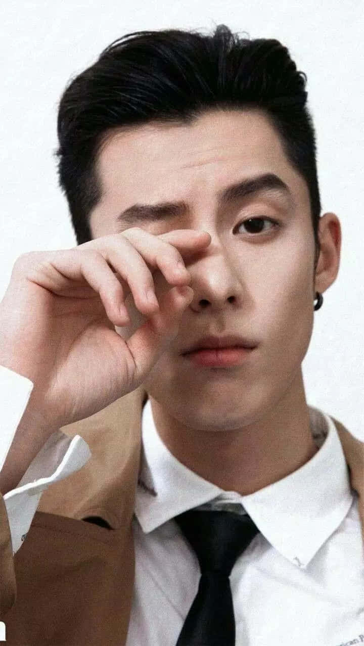 Dylan Wang Hand On His Eye Background