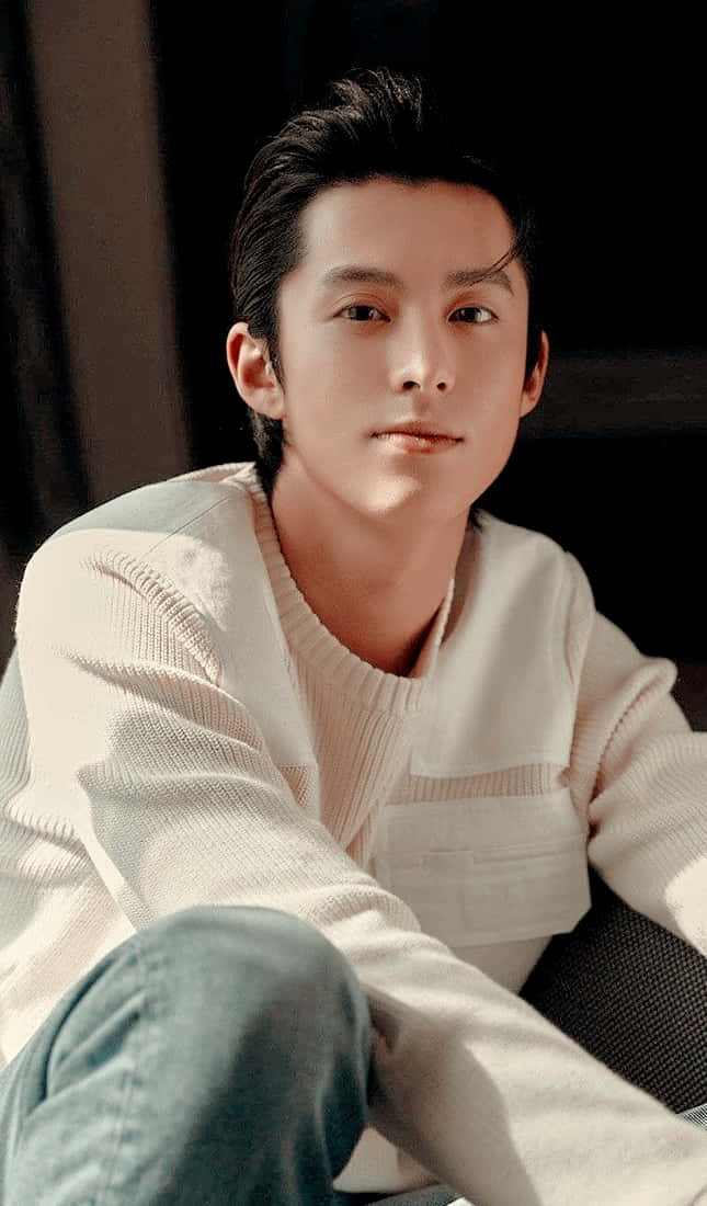 Dylan Wang In A White Sweater Background