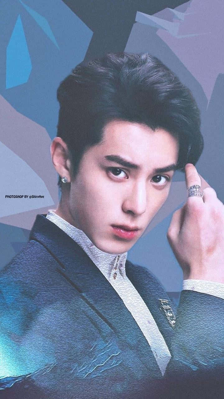 Dylan Wang Wearing A Blue Suit With Ring On His Finger Background