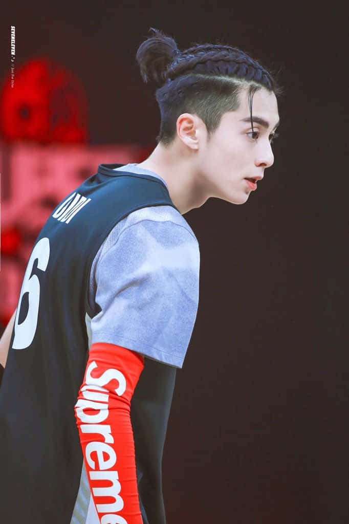 Dylan Wang Wearing A Sport Attire Background