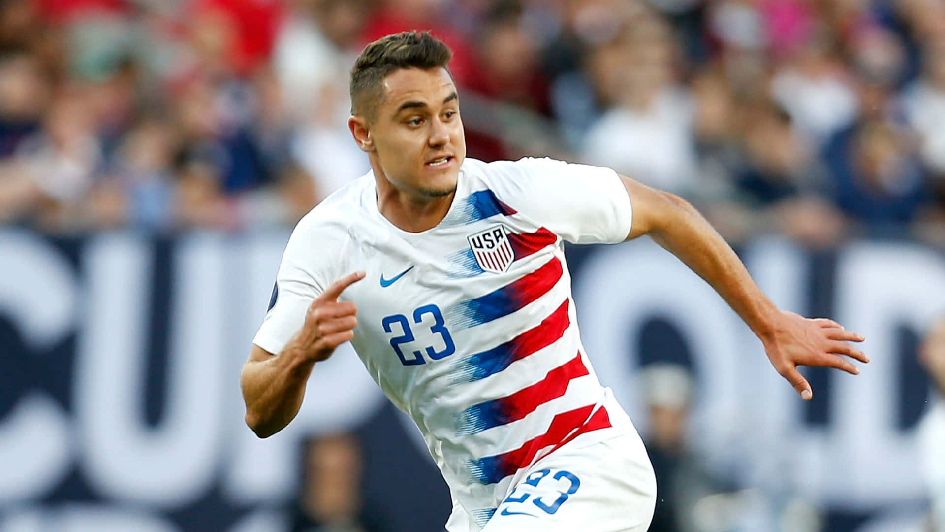 Dynamic American Soccer Player, Aaron Long In Action Background