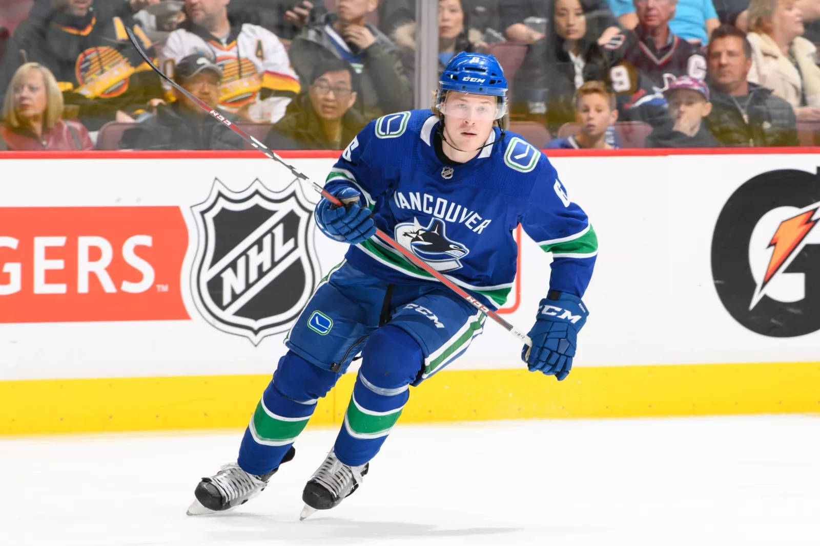 Dynamic And Focused Brock Boeser In Action During 2018 Nhl Game Background