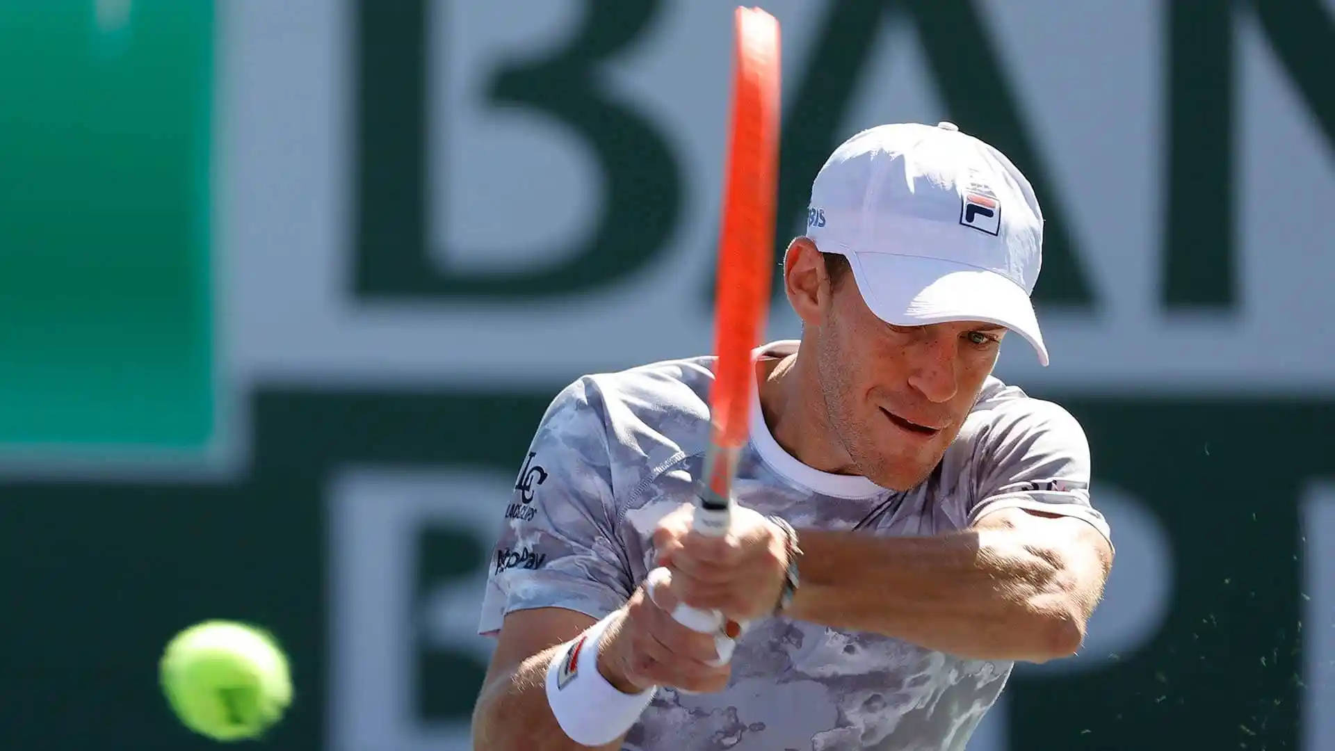 Dynamic Diego Schwartzman Chasing A Tennis Ball In Court Background