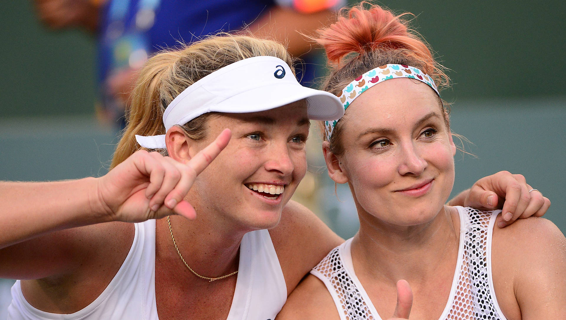 Dynamic Duo - Bethanie Mattek-sands And Coco Vandeweghe In Competition Background