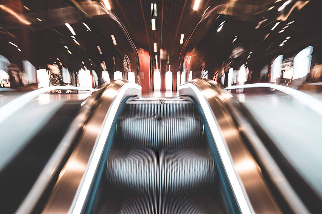 Dynamic Escalator In Motion Background