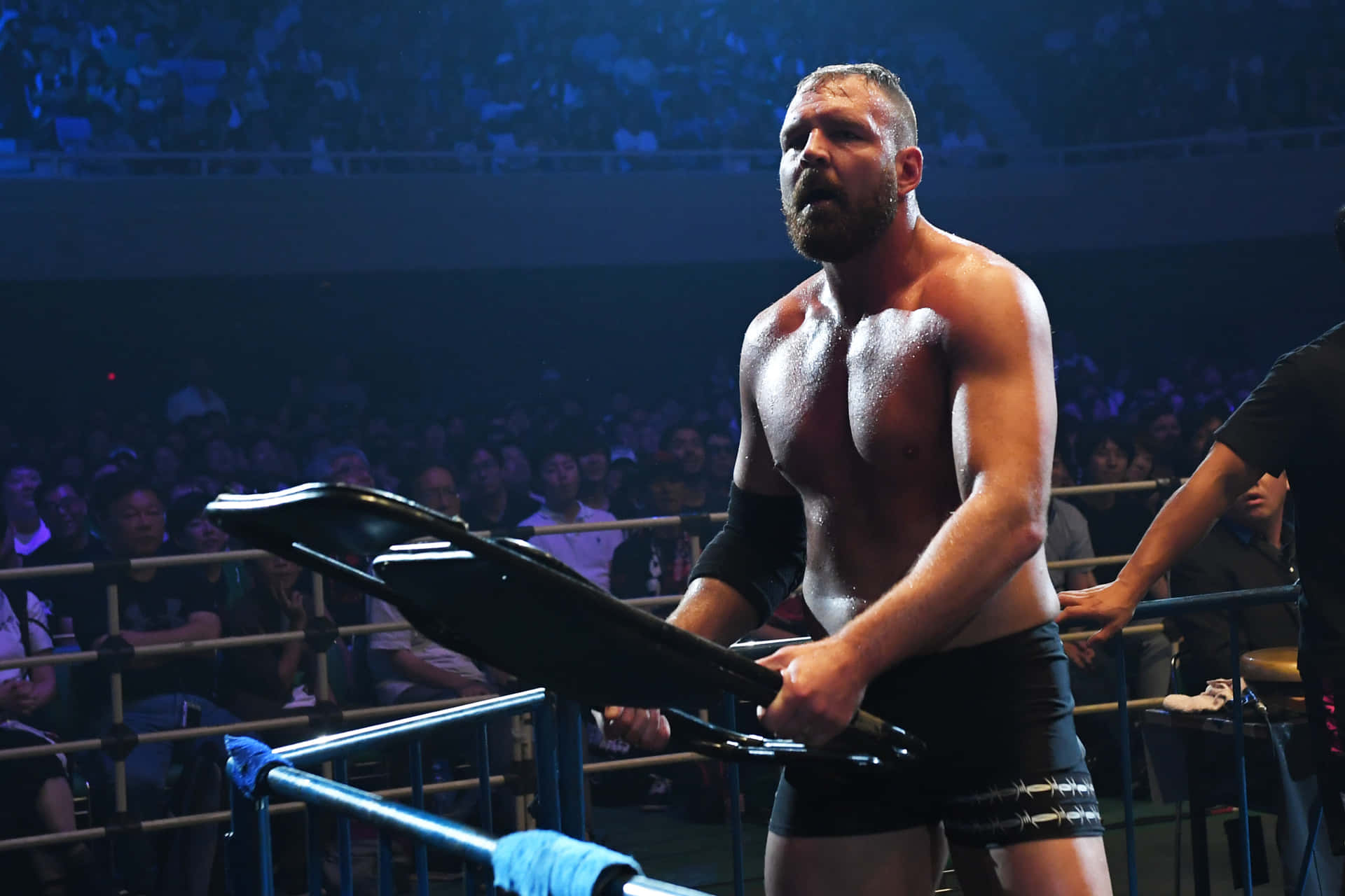 Dynamic Jon Moxley In-action At A Wrestling Event Background