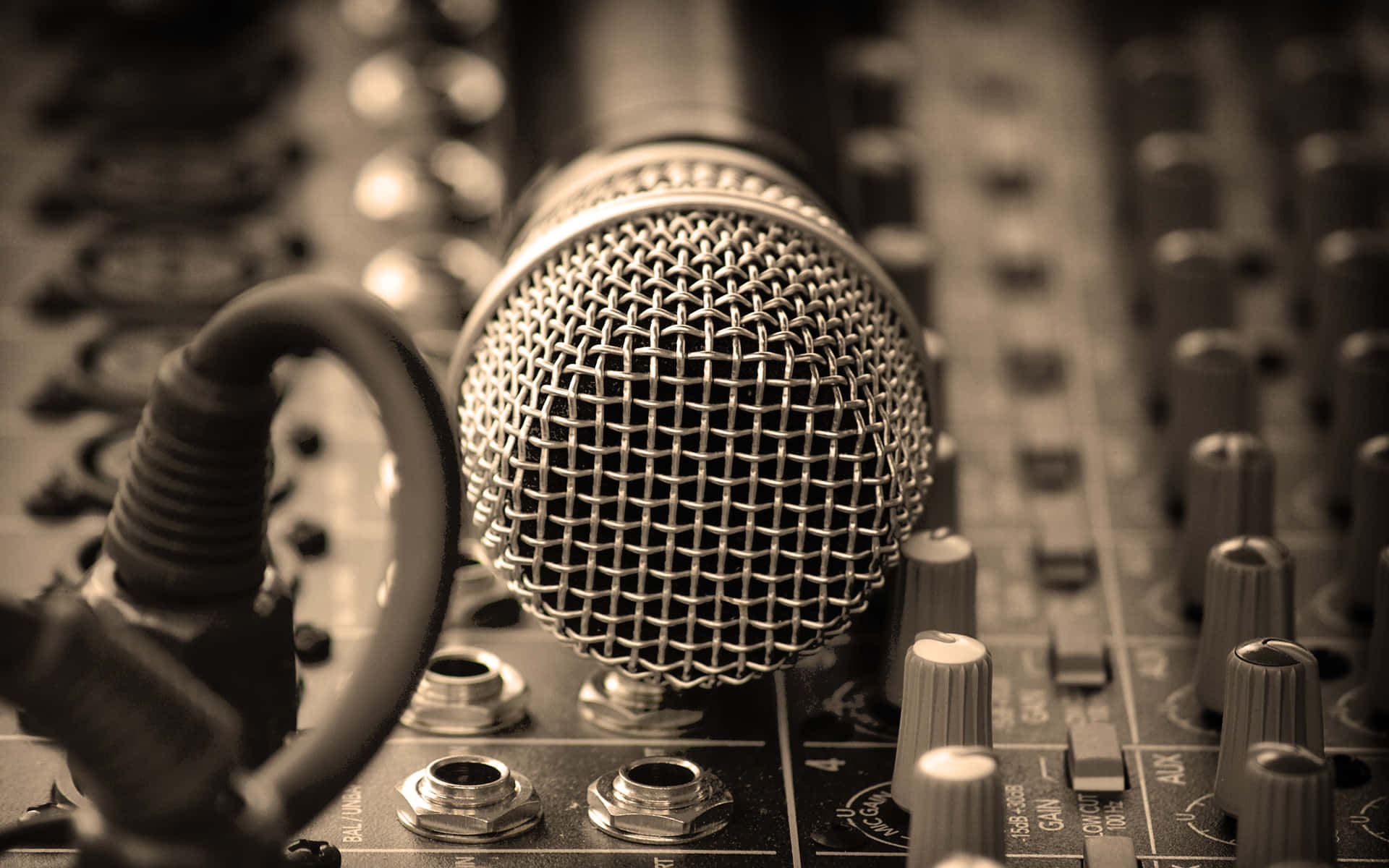 Dynamic Microphone On A Mixing Console Background