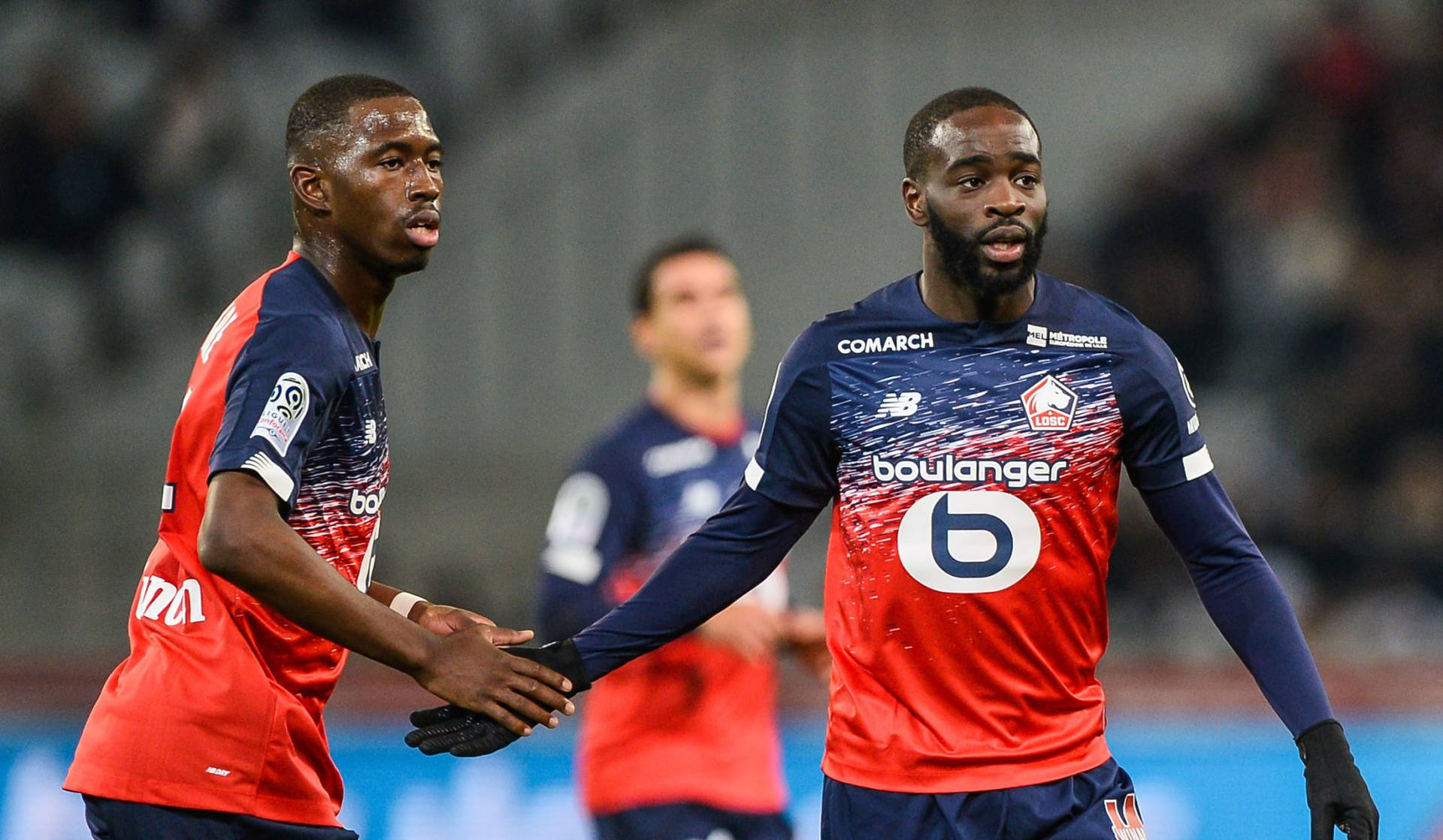 Dynamic Midfielder Boubakary Soumaré In Action Background