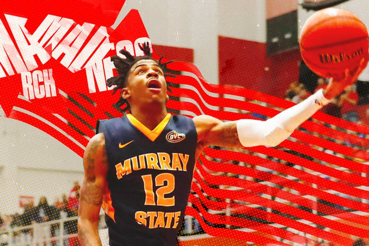 Dynamic Move: Ja Morant Performs A High-flying Layup Background
