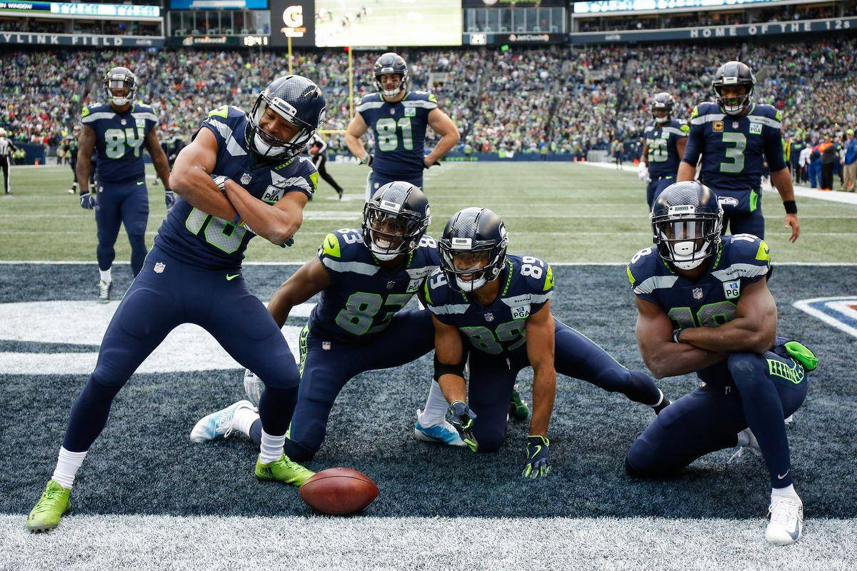 Dynamic Nfl Player Tyler Lockett On The Field